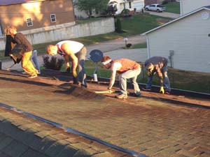 view from top of roof, men working