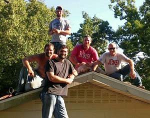 men posing on roof