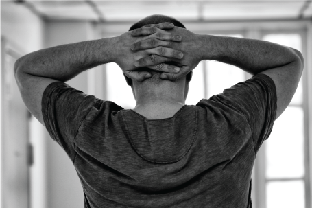 clasped hands on head black and white picture window